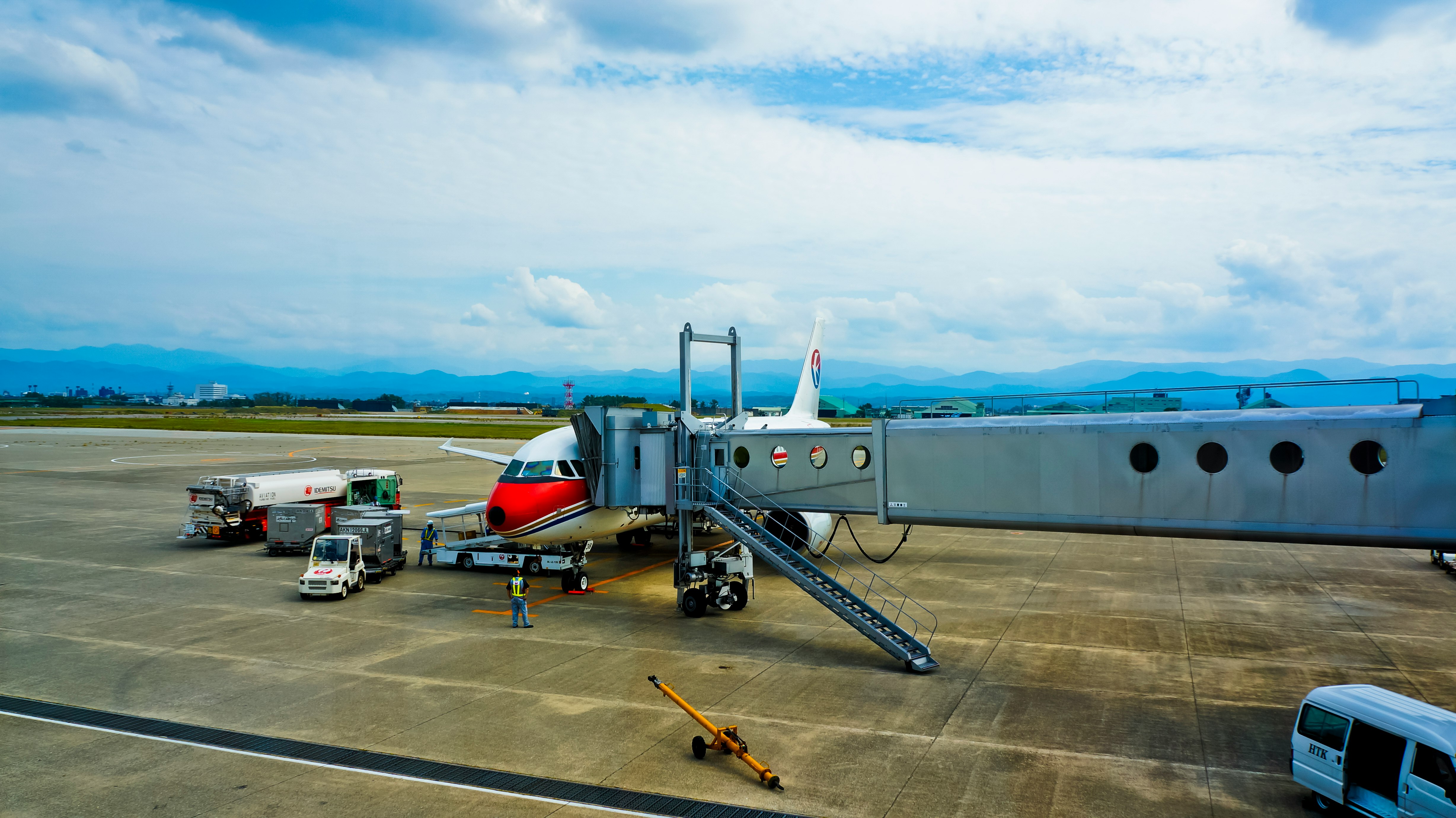 passenger plane beside tunnel passenger